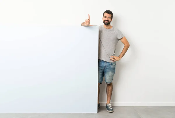 Young Handsome Man Beard Holding Big Blue Empty Placard Showing — Stock Photo, Image