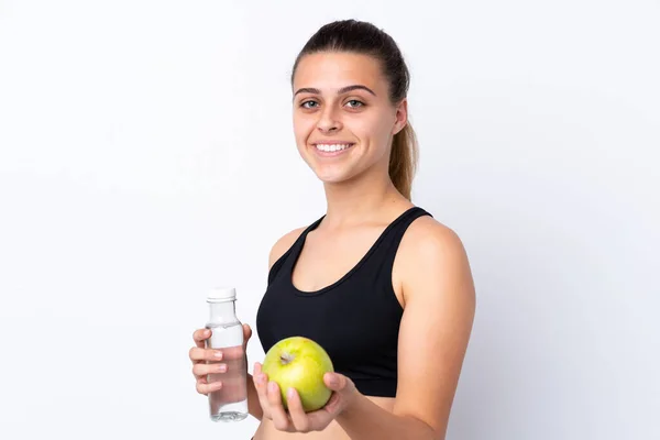 Adolescente avec une pomme et une bouteille d'eau sur isolé — Photo