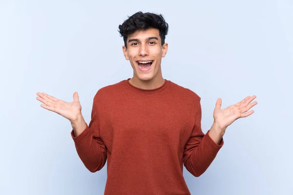 Young Argentinian Man Isolated Blue Background Shocked Facial Expression — Stock Photo, Image