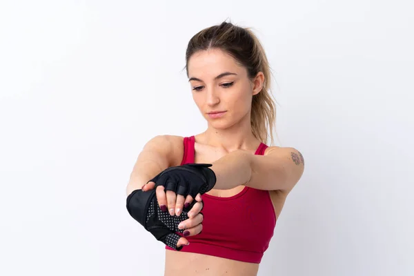 Ung Sport Kvinna Över Isolerad Vit Bakgrund Stretching Arm — Stockfoto