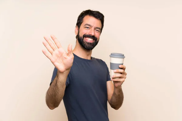 Man Met Baard Met Een Koffie Saluerend Met Hand Met — Stockfoto