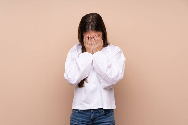 Young girl over isolated background with tired and sick expression