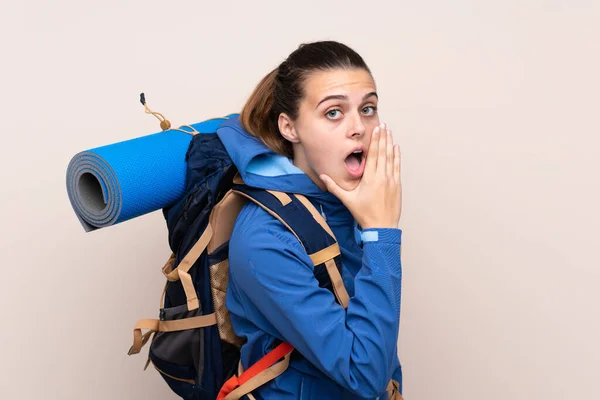 Young Mountaineer Girl Big Backpack Isolated Background Whispering Something — Stock Photo, Image