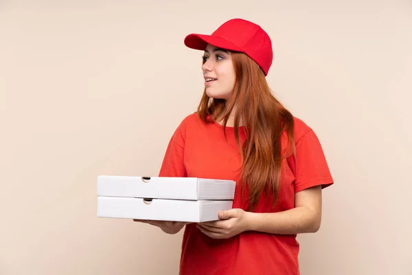 Pizza Delivery Teenager Girl Holding Pizza Isolated Background Looking Side — Stock Photo, Image