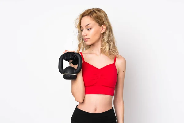 Ung Blond Kvinna Isolerad Vit Bakgrund Gör Tyngdlyftning Med Kettlebell — Stockfoto