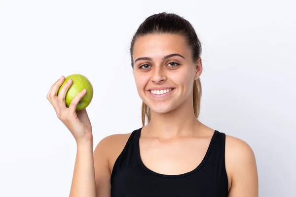Tinédzser lány egy almát át elszigetelt háttér — Stock Fotó