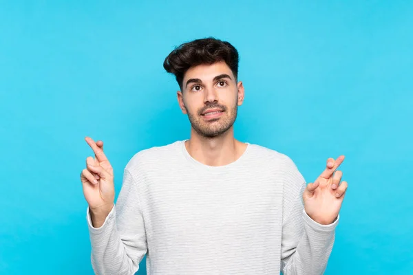 Young Man Isolated Blue Background Fingers Crossing Wishing Best — Stock Photo, Image