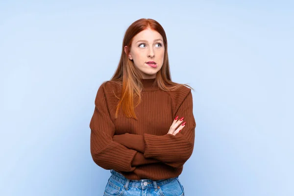 Young Redhead Woman Isolated Blue Background Confuse Face Expression — Stock Photo, Image