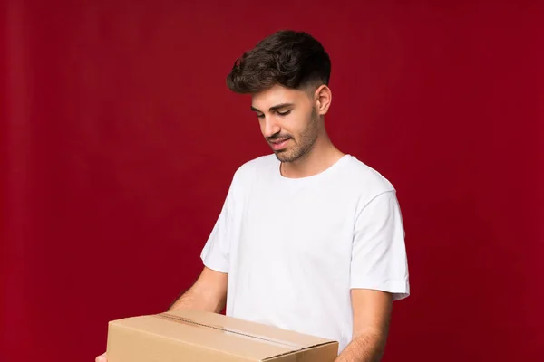 Young Man Isolated Background Holding Box Move Another Site — Stock Photo, Image