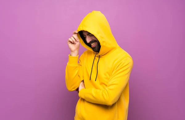 Happy Handsome man with yellow sweatshirt