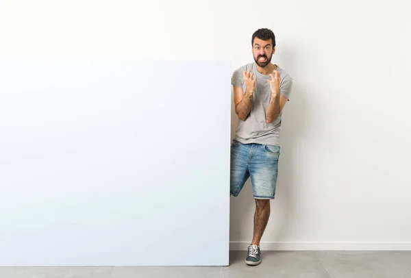 Young Handsome Man Beard Holding Big Blue Empty Placard Frustrated — Stock Photo, Image