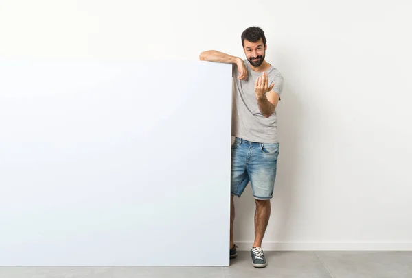 Young Handsome Man Beard Holding Big Blue Empty Placard Inviting — Stock Photo, Image