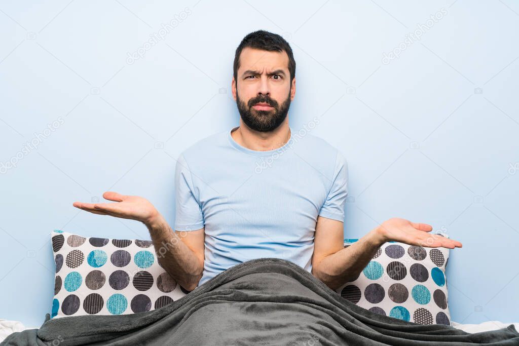 Man in bed unhappy for not understand something