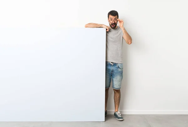 Young Handsome Man Beard Holding Big Blue Empty Placard Glasses — Stock Photo, Image