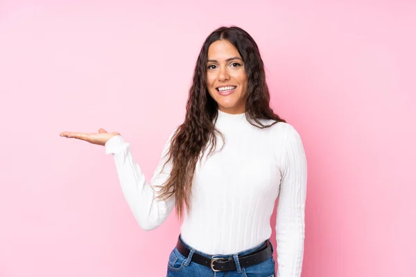 Young Woman Isolated Pink Background Holding Copyspace Imaginary Palm Insert — Stock Photo, Image