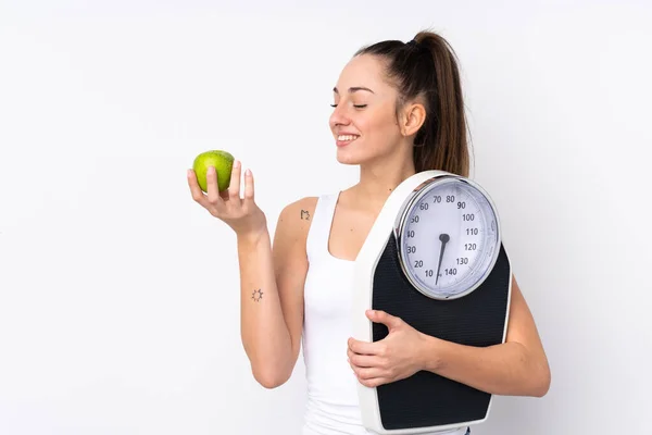 Young Brunette Woman Isolated White Background Weighing Machine Apple — Stock Photo, Image