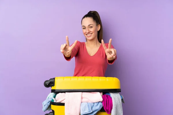 Traveler Woman Suitcase Full Clothes Isolated Purple Background Smiling Showing — Stock Photo, Image