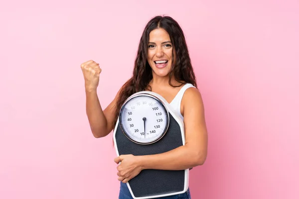 Young Woman Isolated Pink Background Weighing Machine Doing Victory Gesture — Stock Photo, Image
