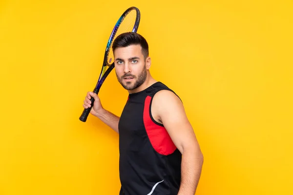 Hombre Sobre Aislado Amarillo Fondo Jugando Tenis —  Fotos de Stock