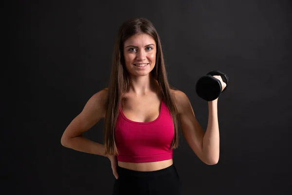 Ung Sport Kvinna Att Göra Tyngdlyftning Över Isolerade Svart Bakgrund — Stockfoto