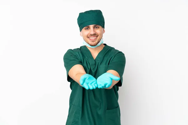 Surgeon Green Uniform Isolated Isolated White Background Holding Copyspace Imaginary — Stock Photo, Image