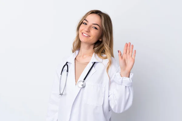 Young Woman Isolated White Background Wearing Doctor Gown Saluting — Stock Photo, Image