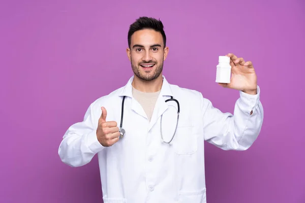 Young Man Wearing Doctor Gown Holding Pills — 스톡 사진