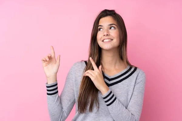 Teenager Mädchen Über Isoliertem Rosa Hintergrund Der Mit Dem Zeigefinger — Stockfoto