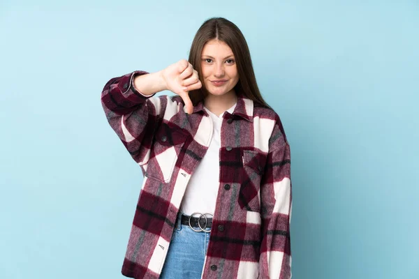 Teenager Caucasian Girl Isolated Blue Background Showing Thumb Negative Expression — Stock Photo, Image