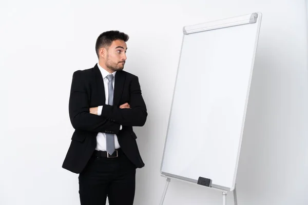 Joven Dando Una Presentación Pizarra Blanca Haciendo Gesto Dudas —  Fotos de Stock