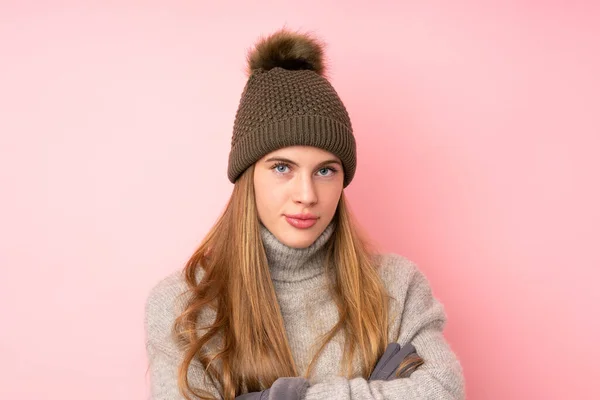 Young Teenager Girl Winter Hat Isolated Pink Background Keeping Arms — Stock Photo, Image