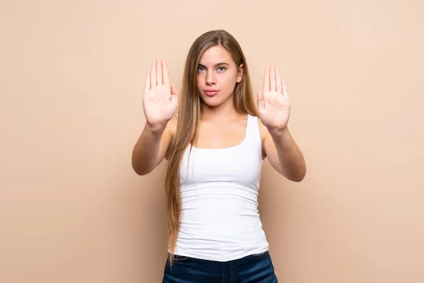 Teenager Blonde Girl Isolated Background Making Stop Gesture Disappointed — Stock Photo, Image