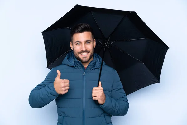 Muž Držící Deštník Nad Izolovaným Pozadím Palci Nahoru Protože Stalo — Stock fotografie