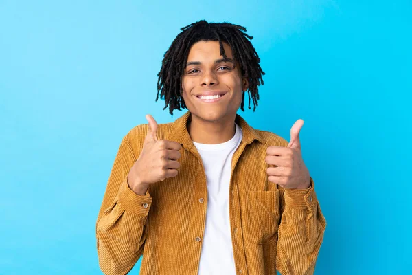 Young African American Man Corduroy Jacket Isolated Blue Background Giving — стокове фото