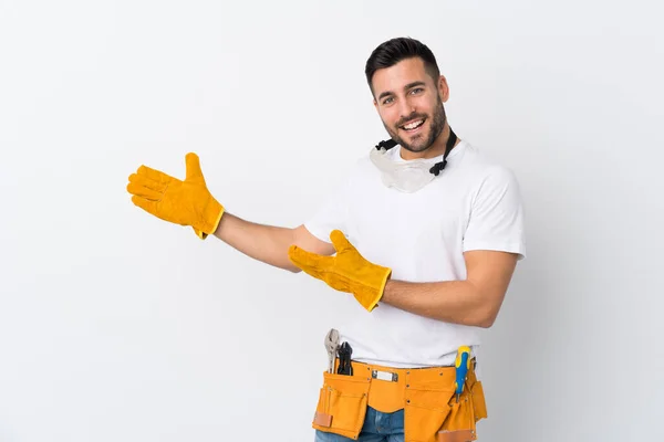 Craftsmen Electrician Man Isolated White Background Extending Hands Side Inviting — Stock Photo, Image
