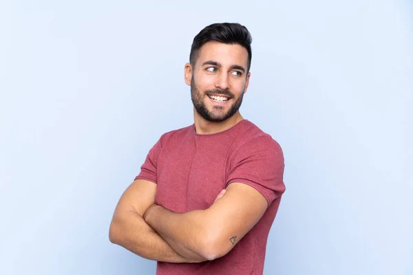 Jovem Bonito Homem Com Barba Sobre Isolado Fundo Azul Com — Fotografia de Stock