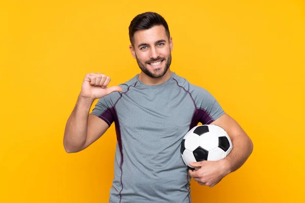 Man Isolated Yellow Background Soccer Ball Proud Himself — Stock Photo, Image