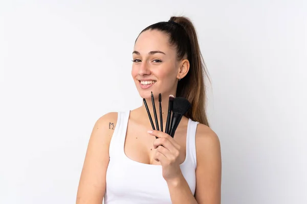 Young Brunette Woman Isolated White Background Holding Makeup Brush — 스톡 사진