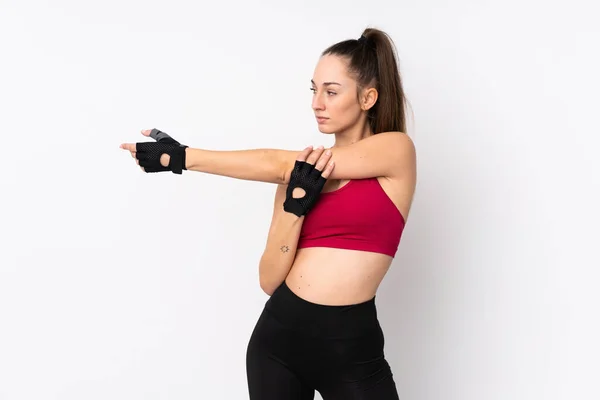 Ung Sport Brunett Kvinna Över Isolerad Vit Bakgrund Stretching Arm — Stockfoto