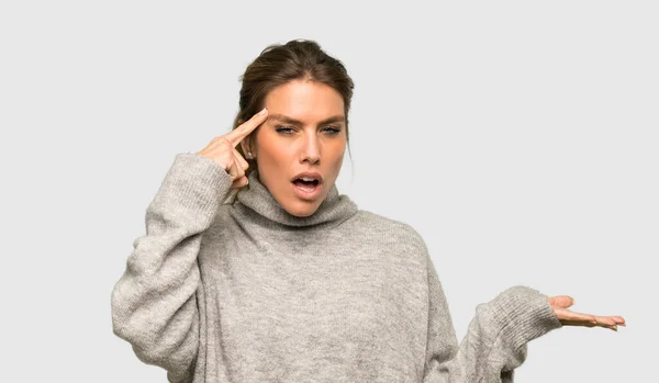 Blonde Woman Turtleneck Making Gesture Madness Putting Finger Head Isolated — Stock Photo, Image