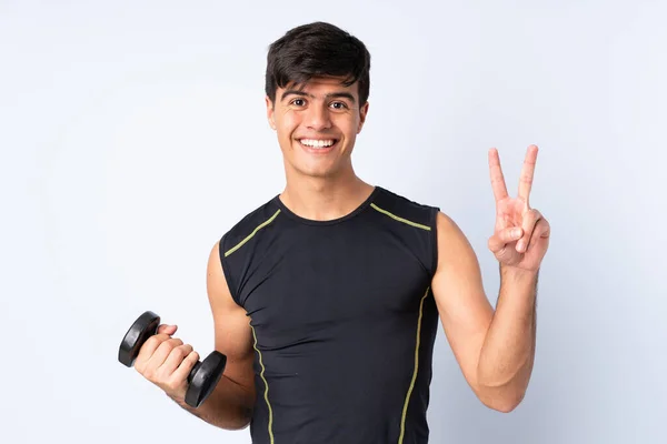Sport Man Making Weightlifting Isolated Blue Background Smiling Showing Victory — Stock Photo, Image