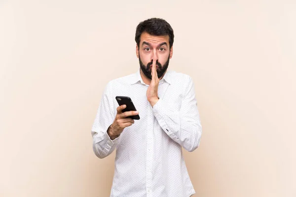 Young Man Beard Holding Mobile Keeps Palm Together Person Asks — Stock Photo, Image