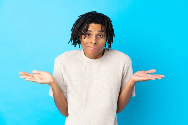 Young African American Man Isolated Blue Background Having Doubts While — Stock Photo, Image