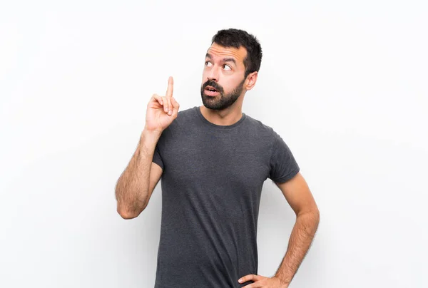 Jonge Knappe Man Geïsoleerde Witte Achtergrond Denken Een Idee Wijzend — Stockfoto