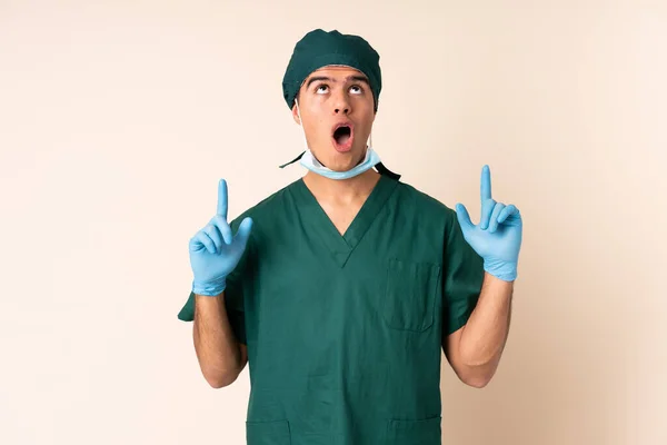 Cirujano Uniforme Azul Sobre Fondo Aislado Señalando Con Dedo Índice — Foto de Stock