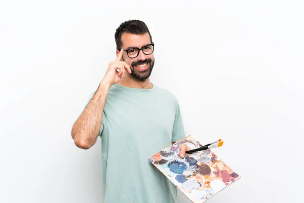 Genç Bir Sanatçı Arka Planda Gözlüklü Mutlu Bir Palet Tutuyor — Stok fotoğraf