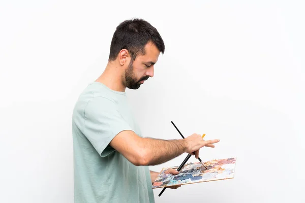 Jovem Artista Homem Segurando Uma Paleta Sobre Fundo Isolado — Fotografia de Stock