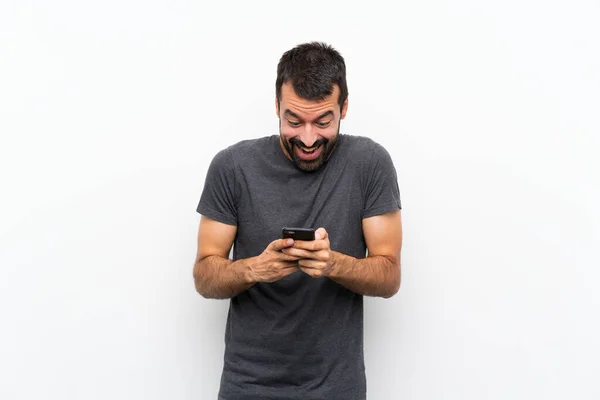 Joven Hombre Guapo Sobre Fondo Blanco Aislado Sorprendido Enviando Mensaje —  Fotos de Stock