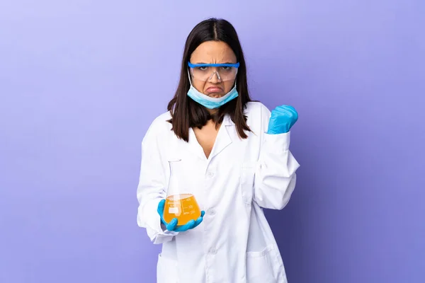 Scientist woman investigating a vaccine to cure coronavirus disease with unhappy expression