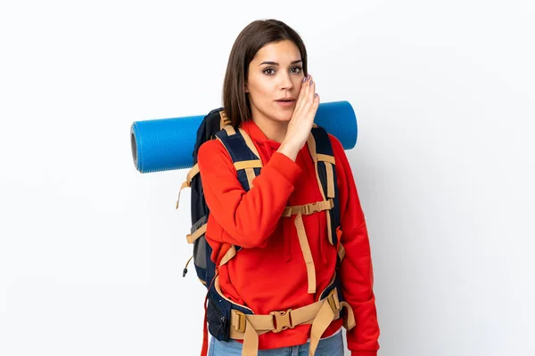Young Caucasian Mountaineer Girl Big Backpack Isolated White Background Whispering — Stock Photo, Image